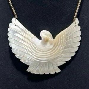 Vintage Mother Of Pearl Eagle Pendant Necklace
2.75" Cream Gold-tone Hand Carved